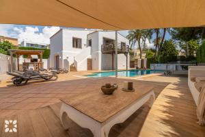 a patio with a table in front of a house at Villa Yelir by Abahana Villas in Calpe