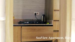 a kitchen with a stove and a counter top at Seaview Apartment, Ikoyi in Lagos