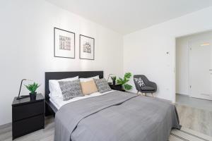 Tempat tidur dalam kamar di Spirit Apartments by UrbanRent