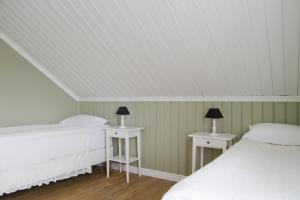 Ένα ή περισσότερα κρεβάτια σε δωμάτιο στο Lónsleira Apartments