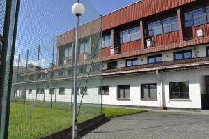 a building with a street light in front of it at Ośrodek Sportu i Rekreacji Victoria in Bielsko-Biała