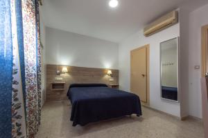 Posteľ alebo postele v izbe v ubytovaní Hotel San Andres