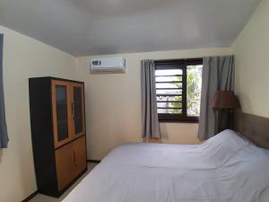 Postel nebo postele na pokoji v ubytování Paea Lodge