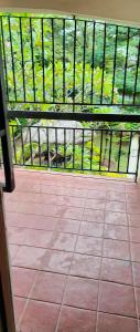 a view of a room with a window and a tiled floor at Kafka Gardens in Kisumu