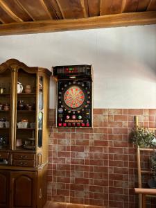 a dart board on the wall of a room at Kuća za odmor Vallirea in Kaptol