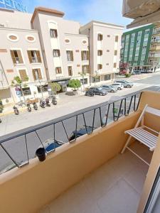 a balcony with a view of a street and buildings at Nuevo apartamento cerca del mar in Denia