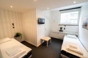 Postel nebo postele na pokoji v ubytování Stockholm Hostel + 37 fotografií