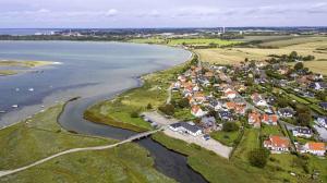 an aerial view of a small town next to the water at Funen Cottage With Fantastic Sea View, in Assens