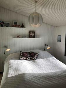 a bedroom with a bed with two pillows on it at Funen Cottage With Fantastic Sea View, in Assens