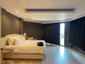 Postel nebo postele na pokoji v ubytování Solis Beach Hotel Rajamangala