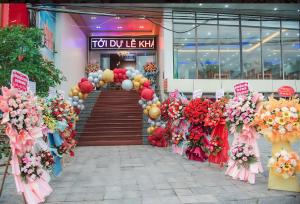 a front entrance to a store with flowers and balloons at UFJ HOTEL Sầm Sơn in Sầm Sơn