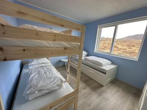Ein Bett oder Betten in einem Zimmer der Unterkunft Cabin in Faukás, west part of Iceland - Birta Rentals