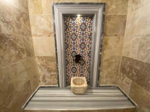 a bathroom with a shower with a toilet in it at Cappadocia Fairy Tale Suites in Goreme