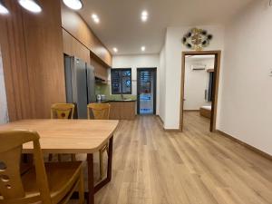a kitchen and dining room with a table and chairs at Căn Hộ Chung cư Hưng Phú in Can Tho +19 photos
