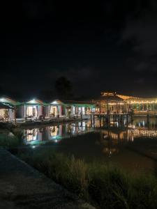 a night view of a marina with lights at Homestay 1999 in Tân Tạo