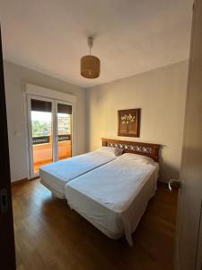 Postel nebo postele na pokoji v ubytování Apartamentos Turísticos Spiritmar