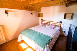 A bed or beds in a room at Palazzo Leopardi