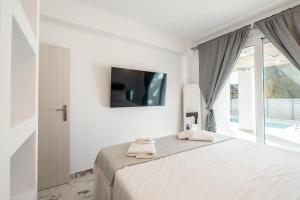 Postel nebo postele na pokoji v ubytování Punta Mare Villa 1 + 26 fotografií