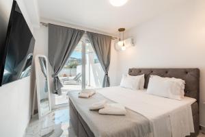 TV a/nebo společenská místnost v ubytování Punta Mare Villa 1