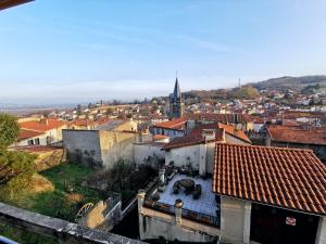 an aerial view of a city with buildings and a church at Suite privative Le seigneur des anneaux Gondor in Vertaizon