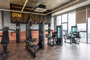 a gym with treadmills and cardio equipment in a building at Millerz Square Near MidValley by YourSuperhost in Kuala Lumpur