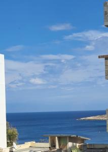 a view of the ocean from a building at Seaview-CasadiAlfio-Qawra in St Paul's Bay