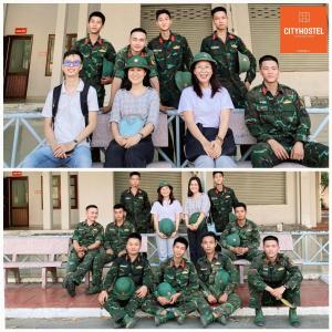 a group of people posing for a picture in uniform at City Hostel Da Nang in Da Nang