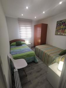 Łóżko lub łóżka w pokoju w obiekcie A CASA DO LADO