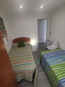 Łóżko lub łóżka w pokoju w obiekcie A CASA DO LADO