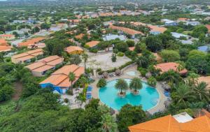 an aerial view of a resort with a pool at Club Seru Coral Ap Toekan in Santa Catharina