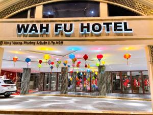 a wah fiu hotel with balloons in front of it at Wah Fu Hotel in Ho Chi Minh City