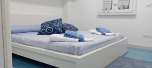 Postel nebo postele na pokoji v ubytování IL RE TRITONE