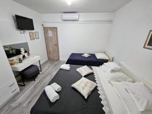 Postel nebo postele na pokoji v ubytování Guest House Antonia