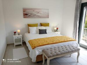 a bedroom with a large bed and a window at Ocean Suite - Villa Luar in Aljezur