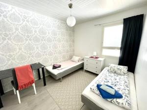 Ένα ή περισσότερα κρεβάτια σε δωμάτιο στο Apartment Isorannantie