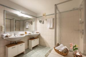 a bathroom with a sink and a shower at Hochfeldalm in Sankt Johann in Tirol