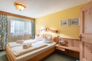 Postel nebo postele na pokoji v ubytování Hochfeldalm