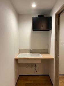 TV i/ili multimedijalni sistem u objektu あざみ庵山中温泉
