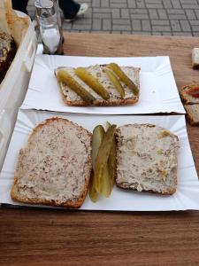 two slices of bread and pickles on a table at PRZYSTANEK nowEKOprzywno - Żółty Domek Pod Kasztanem in Barwice