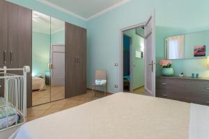 מיטה או מיטות בחדר ב-Casetta Tiffany Mondello
