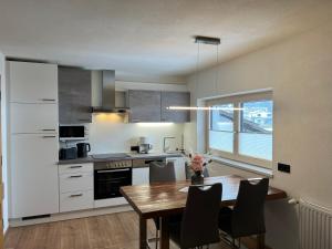 Kuchyň nebo kuchyňský kout v ubytování Apartment Julia