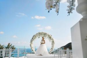 a bride standing under an arch at a wedding at Villa Graziella Positano "a Piece of Paradise" in Positano +51 photos