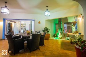 a dining room with a table and chairs at Villa Tuvalu by Abahana Luxe in Moraira