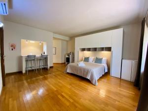 a bedroom with a bed and a table in it at Casa di Chica in Castiglione Falletto