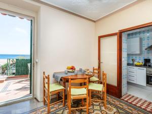 a kitchen and dining room with a table and chairs at Apartment Baldri by Interhome in Tossa de Mar