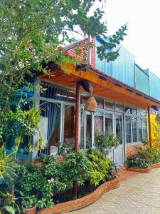 a building with a bunch of plants in front of it at Lam Vien Garden Villa - Homestay Da Lat in Da Lat