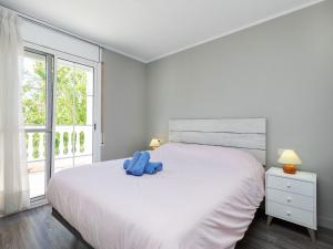 Ένα ή περισσότερα κρεβάτια σε δωμάτιο στο Holiday Home Yoli by Interhome