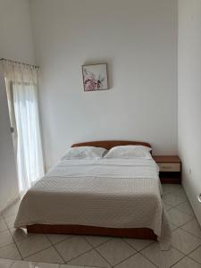 Postel nebo postele na pokoji v ubytování Apartments Nives