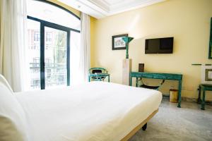 TV a/nebo společenská místnost v ubytování AZZ Mérida Medea Hotel