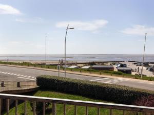 a road with a view of the ocean and a parking lot at Apartment Le Bellevue by Interhome in Saint-Brevin-les-Pins